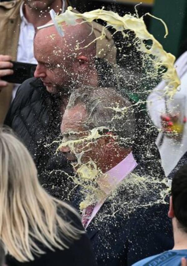 Nigel Farage reacts as he is hit in the face by the contents of a drinks cup. Picture: BEN STANSALL/AFP via Getty Images Nigel Farage reacts as he is hit in the face by the contents of a drinks cup. Picture: BEN STANSALL/AFP via Getty Images