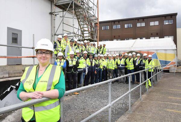 Sarah Faughnan, an Occupational health and wellbeing nurse working with Arcadis at the Intel plant extension in Leixlip, photographed with contractors working on site from Sisk, PM Group, Jacobs , Arcadis, Jones, Mercury, Ross, Kirby, Suir, Actavo, Duffys PJ Hegarty and JLL. Photograph: Moya Nolan Sarah Faughnan, an Occupational health and wellbeing nurse working with Arcadis at the Intel plant extension in Leixlip, photographed with contractors working on site from Sisk, PM Group, Jacobs , Arcadis, Jones, Mercury, Ross, Kirby, Suir, Actavo, Duffys PJ Hegarty and JLL. Photograph: Moya Nolan