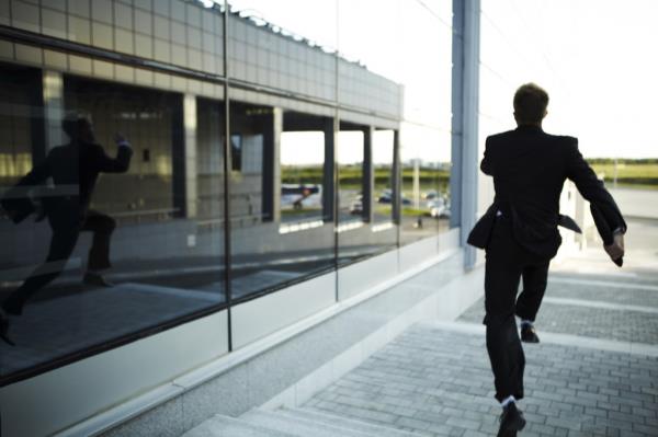 Man in suit running away from something