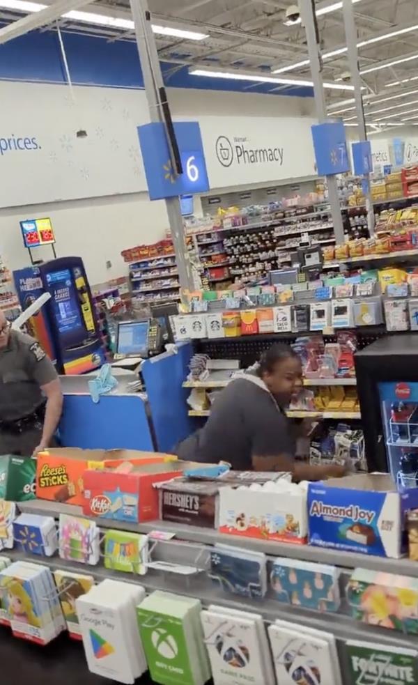 the woman is pictured near the officer