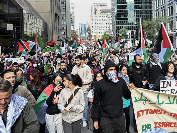 People take part in a pro-Palestine rally in Montreal on Sunday, Oct. 8, 2023. Hamas militants led a surprise attack on Israel from the Gaza Strip on Saturday, leading to hundreds of casualties and retaliation strikes by Israel.