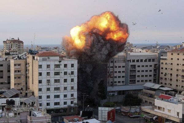 Fire and smoke rise after an Israeli air strike targeted the National Bank on Gaza City, on October 8, 2023. (Photo by AHMED ZAKOUT/AFP via Getty Images) Fire and smoke rise after an Israeli air strike targeted the National Bank on Gaza City, on October 8, 2023. (Photo by AHMED ZAKOUT/AFP via Getty Images)