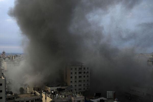 Smoke rises from an explosion on the Islamic National Bank following an Israeli air strike in Gaza City, at Gaza City, Sunday, Oct. 8, 2023. (AP Photo/Adel Hana) Smoke rises from an explosion on the Islamic National Bank following an Israeli air strike in Gaza City, at Gaza City, Sunday, Oct. 8, 2023. (AP Photo/Adel Hana)