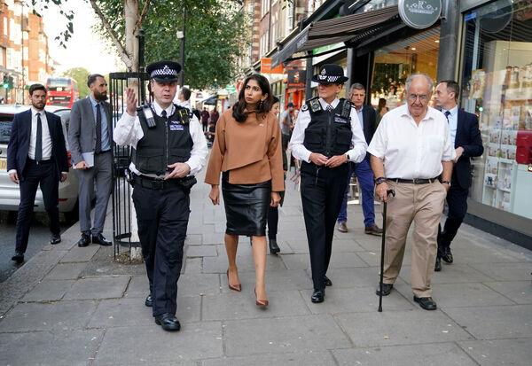 UK home secretary Suella Braverman is accompanied by Metropolitan Police Chief Inspector Rob Gibbs and Lynne Owens, Deputy Commissio<em></em>ner of the Metropolitan Police Service, as they walk along Golder Green Road after visiting the Community Security Trust in London. Picture: Yui Mok/PA Wire