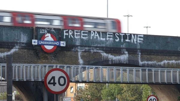 A Tube train bridge, branded with 'Free Palestine' graffiti, is seen in in Golders Green, London, Britain, October 9, 2023. REUTERS/Anna Gordon