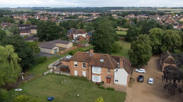 A view of the home of Hannah Ingram-Moore, the daughter of the late Captain Sir Tom Moore, at Marston Moretaine, Bedfordshire. The Captain Tom Foundation has stopped taking money from donors after planning chiefs ordered that an unauthorised building in the home of the daughter of the late charity fundraiser be demolished. Picture date: Wednesday July 5, 2023. PA Photo. Central Bedfordshire Council said a retrospective planning application had been refused and an enforcement notice issued requiring the demolition of the "now-unauthorised building" containing a spa pool. On Tuesday, the foundation put out a statement saying it would not seek donations, and was closing all payment channels, while the Charity Commission carried out an inquiry. See PA story SOCIAL CaptainTom. Photo credit should read: Joe Giddens/PA Wire