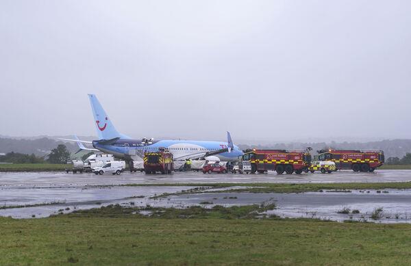 Emergency services at the scene after a passenger plane came off the runway at Leeds Bradford Airport while landing in windy conditions during Storm Babet. Picture: Danny Lawson/PA Wire Emergency services at the scene after a passenger plane came off the runway at Leeds Bradford Airport while landing in windy conditions during Storm Babet. Picture: Danny Lawson/PA Wire