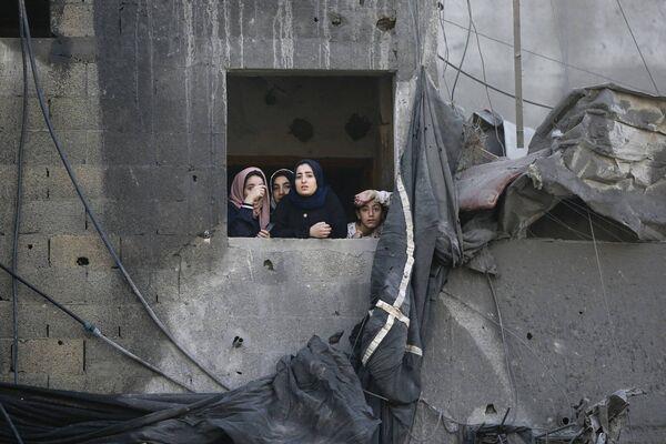 Palestinians gesture as they check the destruction n the aftermath of an Israeli strike the previous night in the Jabalia camp for Palestinian refugees in the Gaza Strip, on November 1, 2023, amid ongoing battles between Israel and the Palestinian Hamas movement. Palestinians gesture as they check the destruction n the aftermath of an Israeli strike the previous night in the Jabalia camp for Palestinian refugees in the Gaza Strip, on November 1, 2023, amid ongoing battles between Israel and the Palestinian Hamas movement.
