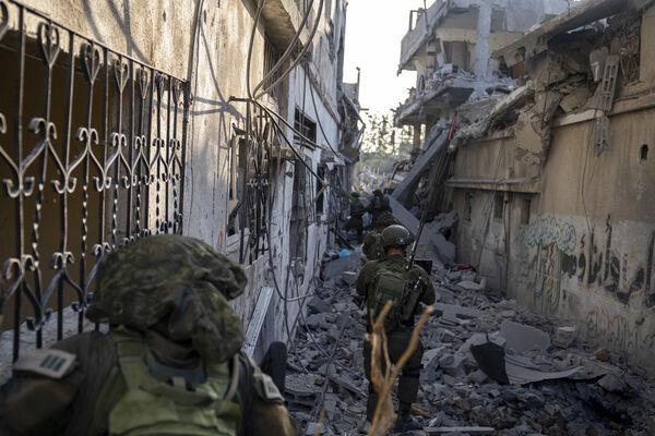 Israeli troops are seen during a ground operation in the Gaza Strip. Israeli ground forces have been operating in Gaza in recent days as Israel presses ahead with its war against Hamas militants. (Picture: Israel Defense Forces via AP)
