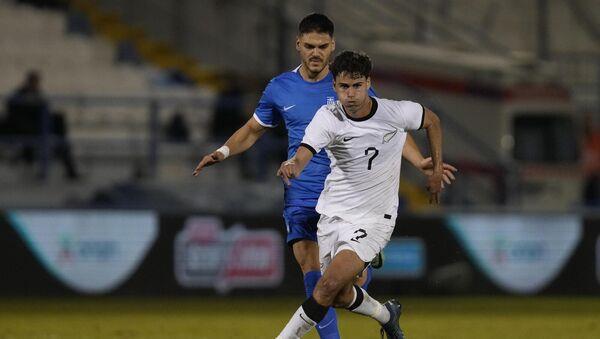 New Zealand's Matt Garbett beats Greece's Konstantinos Mavropanos during an international friendly. New Zealand's Matt Garbett beats Greece's Konstantinos Mavropanos during an international friendly.