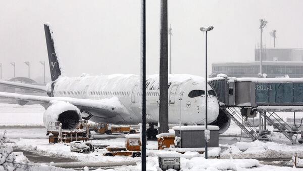 Snowstorm brings Munich airport to standstill and hits travel in central Europe