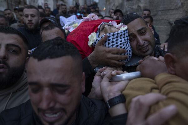 Palestinian mourners carry the body of Ali Alqam, 32, during his funeral in the West Bank refugee camp of Qalandia, south of Ramallah. Picture: AP Photo/Nasser Nasser