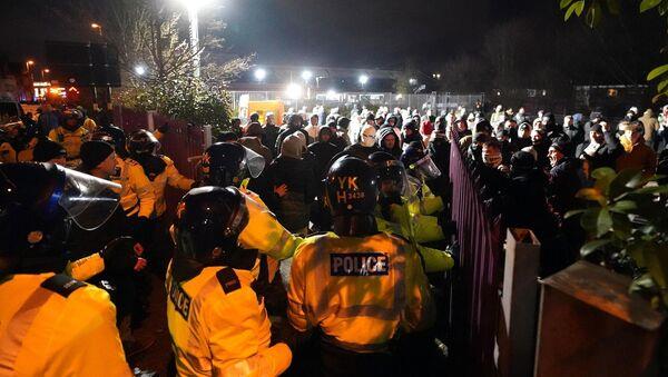 Legia Warsaw fans being sectioned off from the home fans by police. Legia Warsaw fans being sectioned off from the home fans by police.