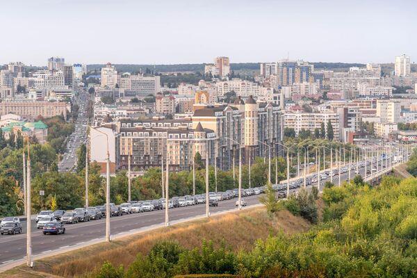 Panorama view of border Belgorod city, Russia, with traffic on the highway and residential areas.