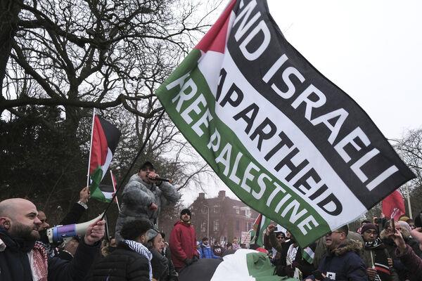 Protestors wave Palestinian flags during a demonstration march outside the International Court of Justice in The Hague, Netherlands, Thursday. Picture: AP Photo/Patrick Post Protestors wave Palestinian flags during a demonstration march outside the International Court of Justice in The Hague, Netherlands, Thursday. Picture: AP Photo/Patrick Post