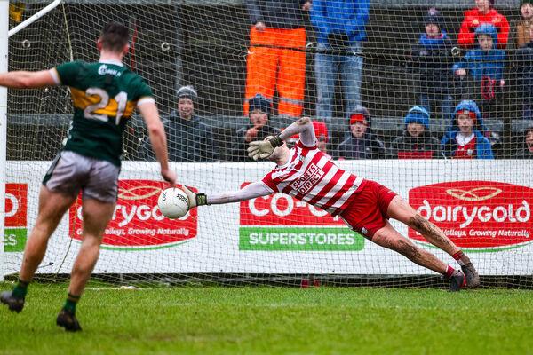 Patrick Doyle of Cork tries to save a penalty of Barry Dan O’Sullivan of Kerry. Pic Credit: Natasha Barton, Inpho.