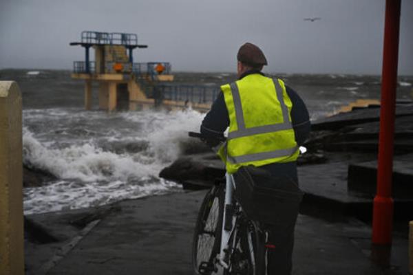 Hardy souls brace the elements at Blackrock diving board in Salthill, during Storm Isha. Picture: Ray Ryan